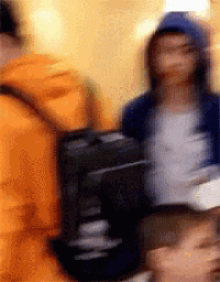 a blurry picture of a person holding a black bag