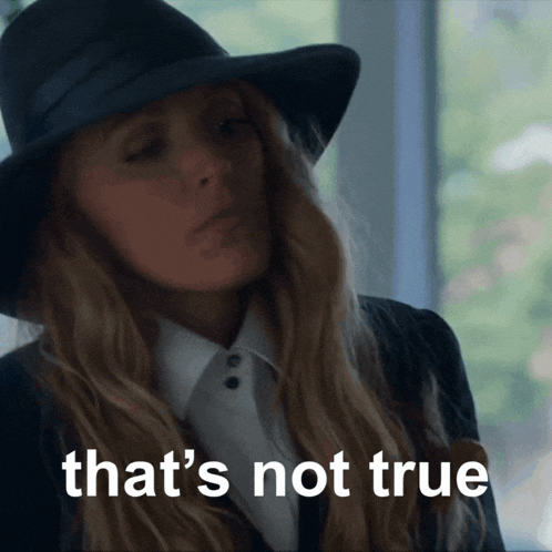 a woman wearing a black hat and a white shirt says that 's not true
