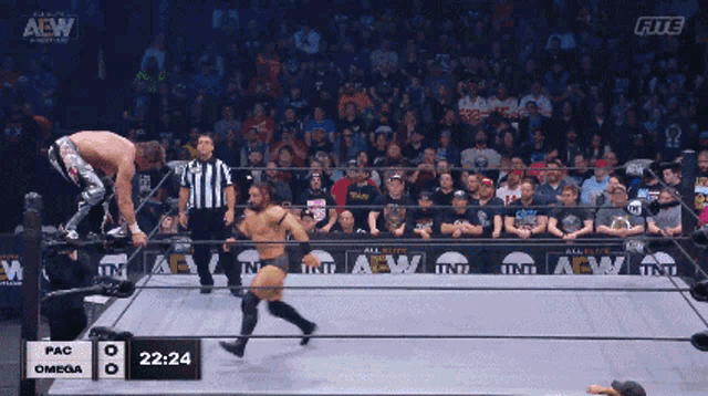 a wrestling match between pac and omega is being shown on the aew channel