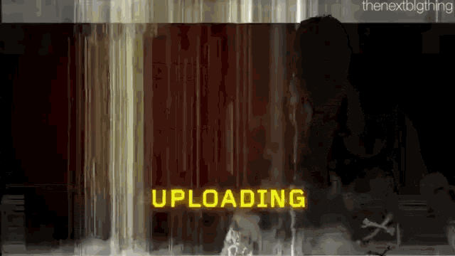 the word uploading is displayed on a screen