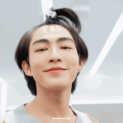 a close up of a person 's face with the words heartchu.gif below