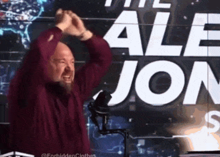 a man with a beard is standing in front of a sign that says " the alle jon "