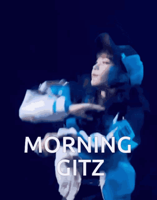 a woman is holding another woman in her arms and the words morning gitz are above her