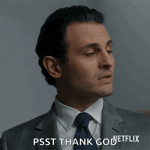a man in a suit and tie says " psst thank god netflix "