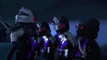 a group of lego ninjago characters are standing in a row holding weapons .