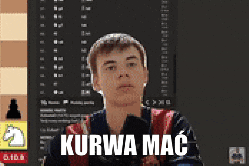 a man sitting in front of a chess board with the word kurwa mac written on the bottom