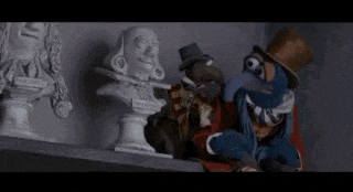a group of muppets are standing next to a statue and saying `` i have 1,274 brothers and sisters . ``