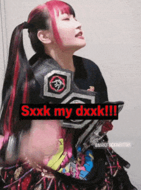 a woman with red and black hair is wearing a belt that says sxxxk my dxxxk !!!