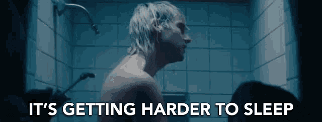 a shirtless man taking a shower with the words it 's getting harder to sleep above him