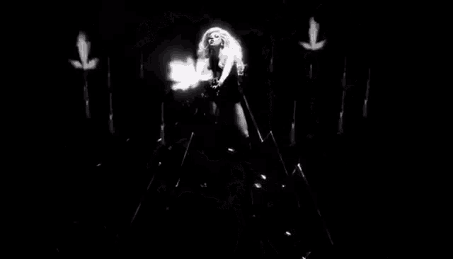 a black and white image of smoke coming out of a hole in a wall .