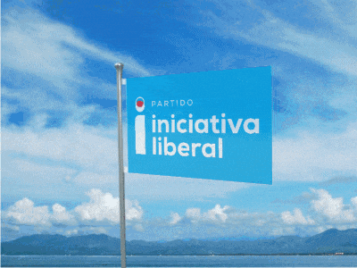 a blue flag with the word ocean on it is flying in front of a body of water