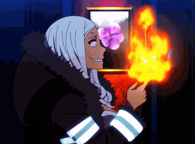 a woman in a black coat is holding a fire in her hand