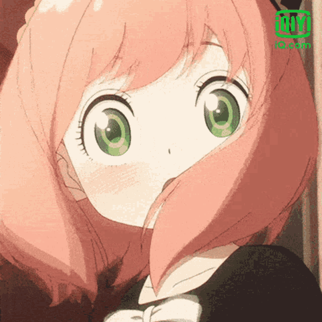 a girl with pink hair and green eyes has an ig.com logo above her head