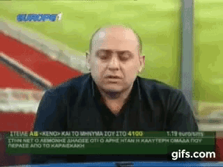 a man sitting in front of a screen that says europe