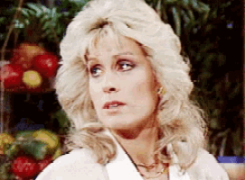 a close up of a woman 's face with a blurred background