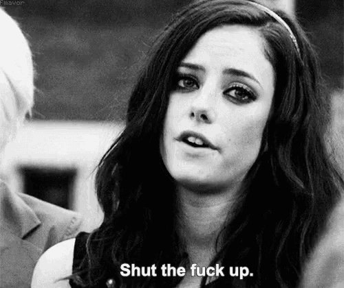 a black and white photo of a woman with the words `` shut the fuck up '' on her face .