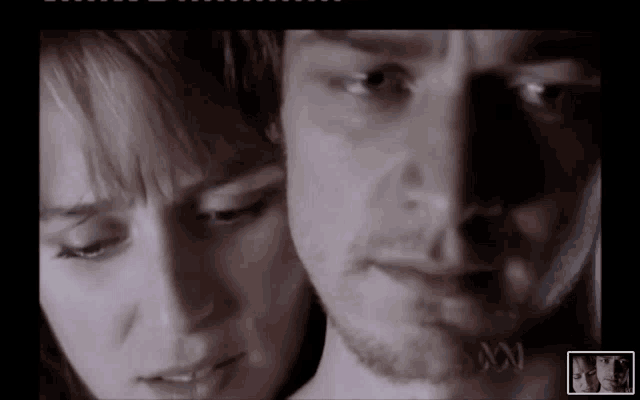 a close up of a man and woman 's faces with the letters a and n on the bottom
