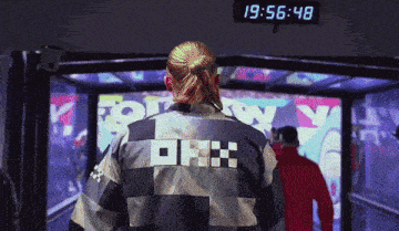 a man wearing a jacket that says tommy on it