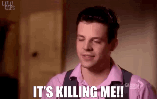 a man in a pink shirt is saying it 's killing me !