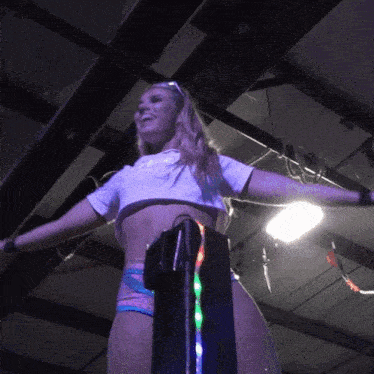 a woman wearing a crop top that says " i love you "