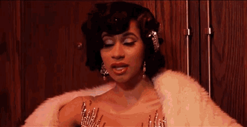 a woman wearing a fur coat and a dress with sequins