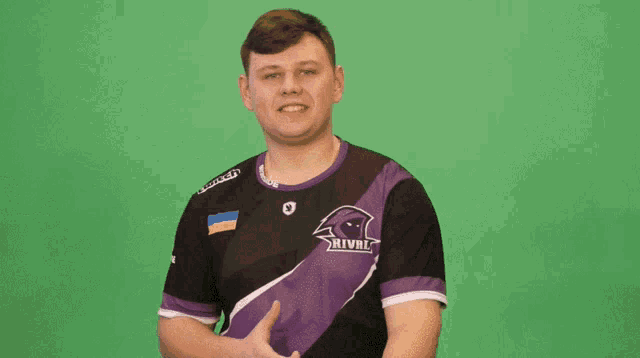 a man in a purple shirt with the word raven on the front
