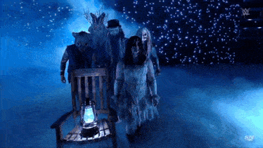 a group of ghosts are standing in a dark room with a sn logo in the corner