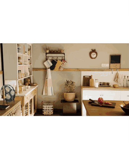 a kitchen with a clock on the wall and a sign that says ' a ' on it