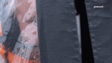 a peacock logo can be seen on the bottom of a black object