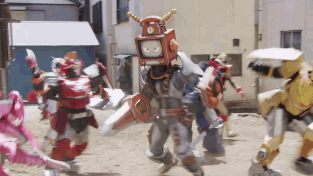 a robot with a clock on his head is surrounded by other robotic characters
