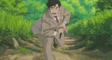 a man in a suit is holding a sword in his right hand