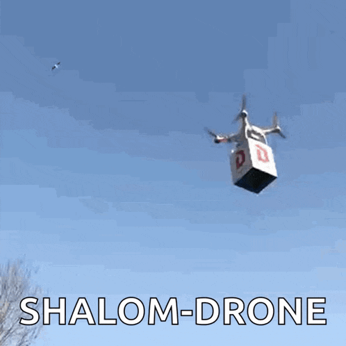 a shalom-drone is flying in the sky with a box attached to it