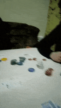 a blurred image of a table with a few cards on it