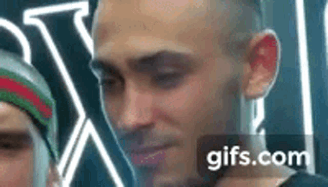 a close up of a man 's face with a gifs.com watermark in the corner .