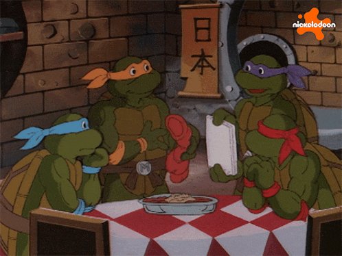 three teenage mutant ninja turtles sitting around a table with a nickelodeon logo
