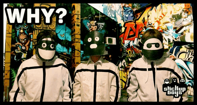 a group of stickup boys standing in front of a graffiti covered wall