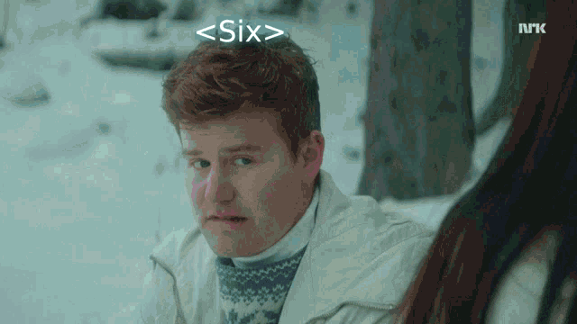 a man in a white jacket is looking at a woman in the snow with the url six written above his head