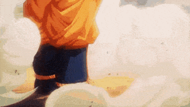 a close up of a person 's legs in a yellow shirt standing in the clouds .