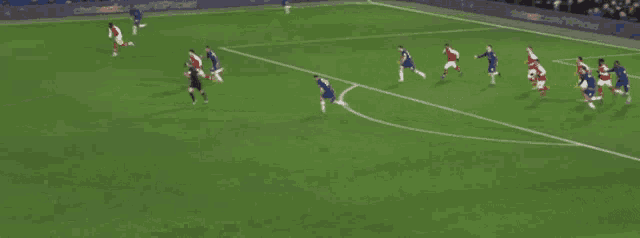 a soccer game is being played on a field with a sign that says every game