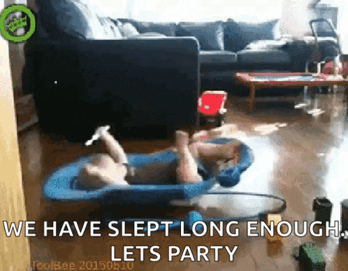 a baby is laying on a stroller in a living room with the words we have slept long enough lets party