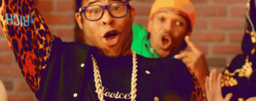 a man wearing glasses and a necklace that says hooice on it