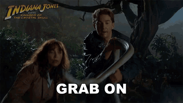 a poster for indiana jones and the kingdom of the crystal skull shows a man holding a snake