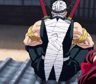 a man with a bandage on his back is sitting on the ground