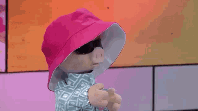 a cartoon character wearing a pink hat and sunglasses says i krokodil