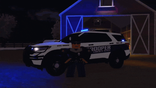 a liberty state trooper is standing in front of a barn