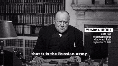 a man sits at a desk with a quote from winston churchill