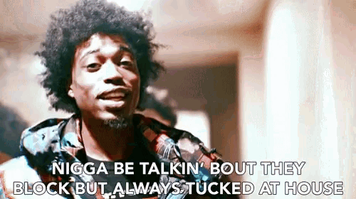 a man in a plaid shirt is saying nigga be talkin bout they block but always tucked at house