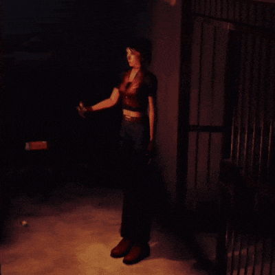 a woman standing in a dark room holding a torch
