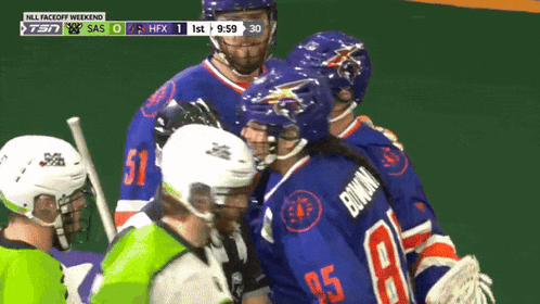 a hockey player with the number 85 on his back talks to another player