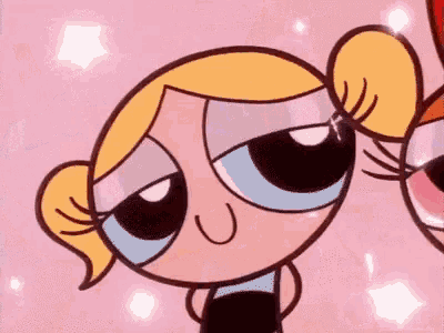 bubbles and buttercup from the powerpuff girls are looking at each other .